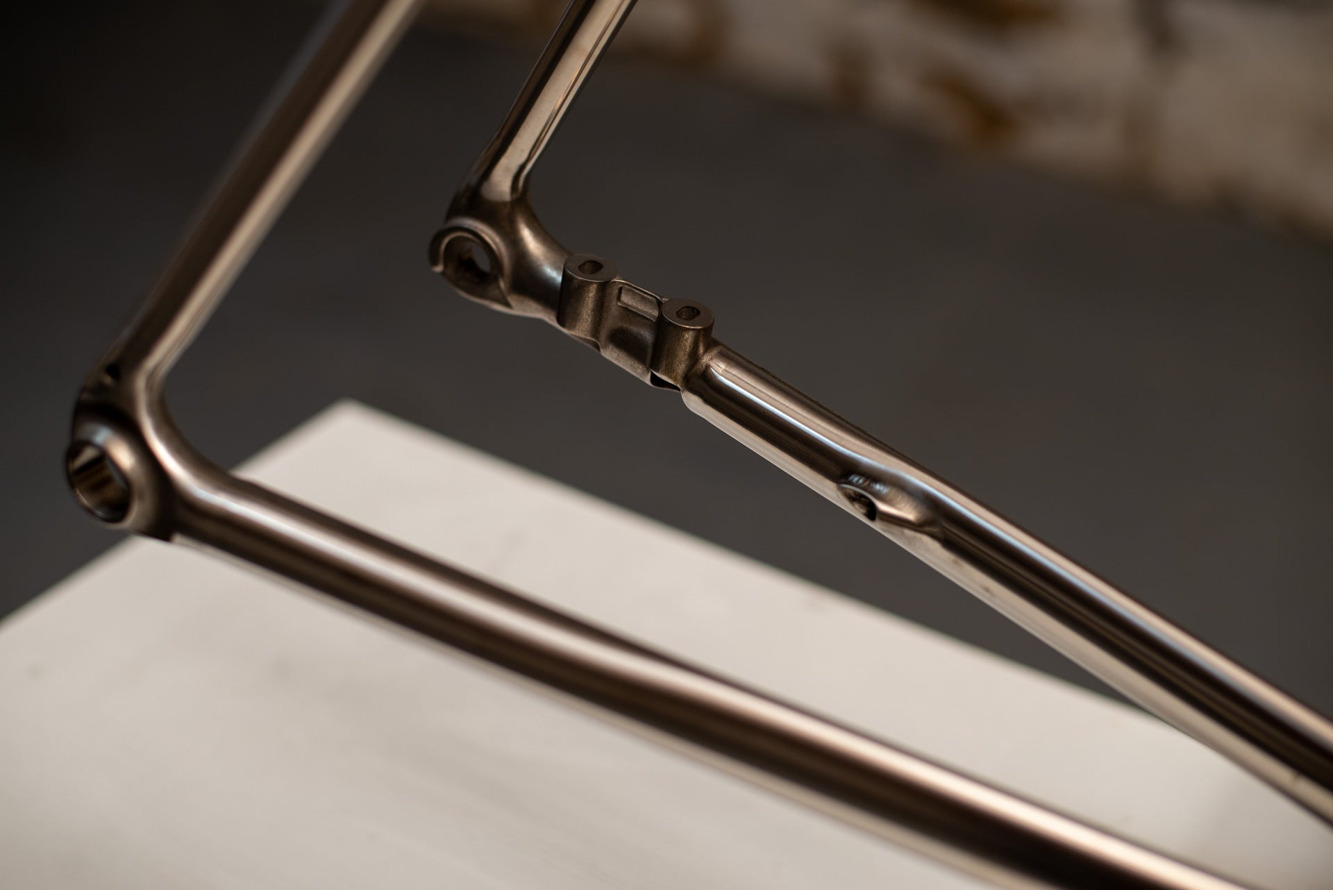 Titanium dropout and UDH derailleur hanger detail with internal routing exit