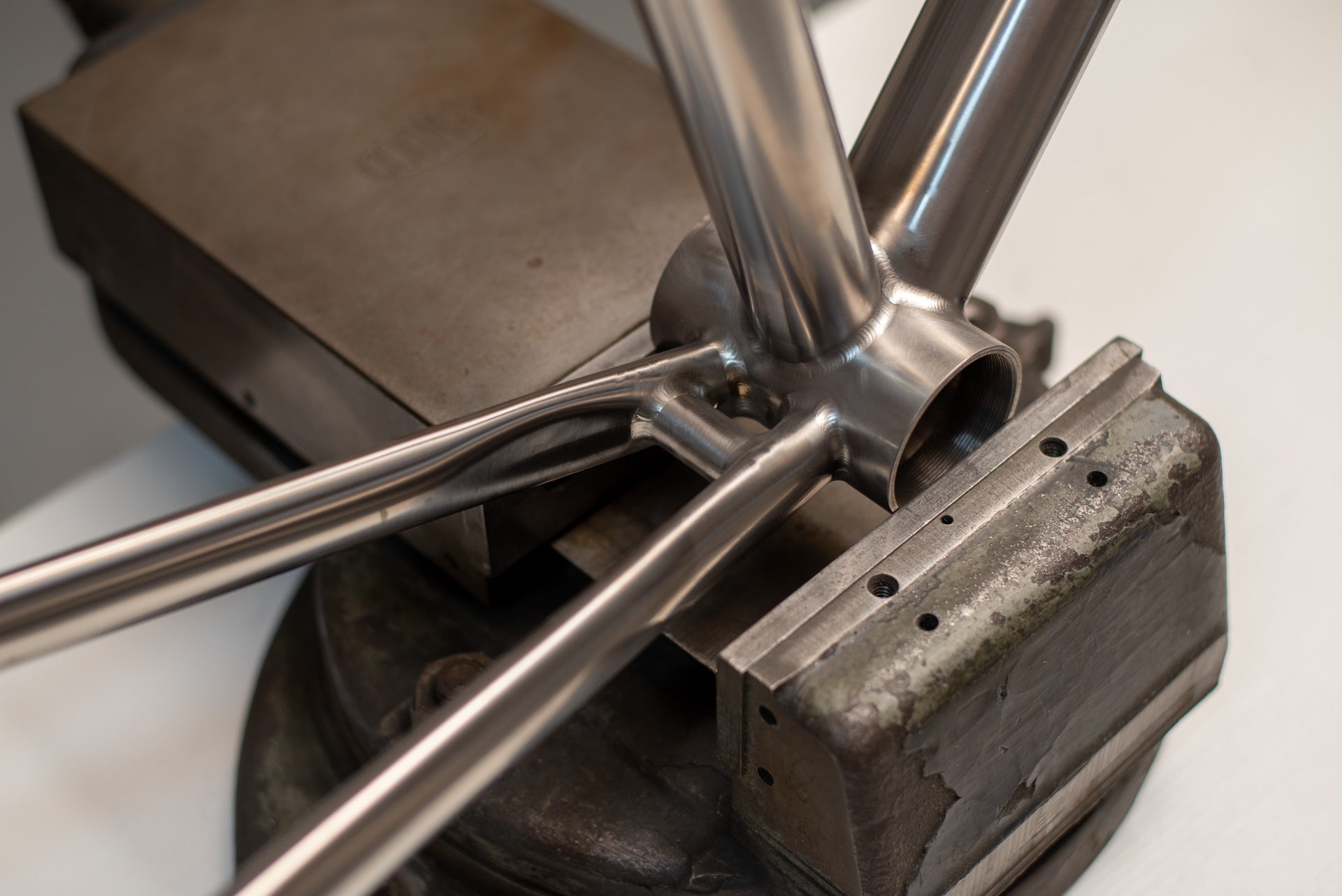 T47 bottom bracket cluster with hand-finished welds